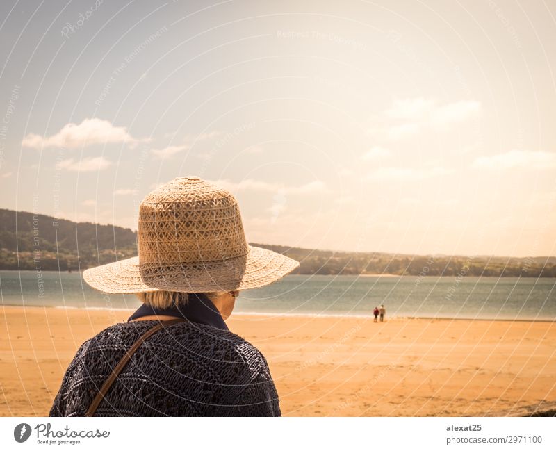 Unrecognizable old woman looking at a couple in a beach Lifestyle Happy Beautiful Summer Sun Beach Ocean Woman Adults Couple Nature Sky Old Love Dream Happiness