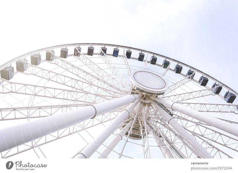 Bottom view of a ferris wheel against a clear sky Joy Relaxation Leisure and hobbies Vacation & Travel Summer Decoration Entertainment Sky Park Steel Old