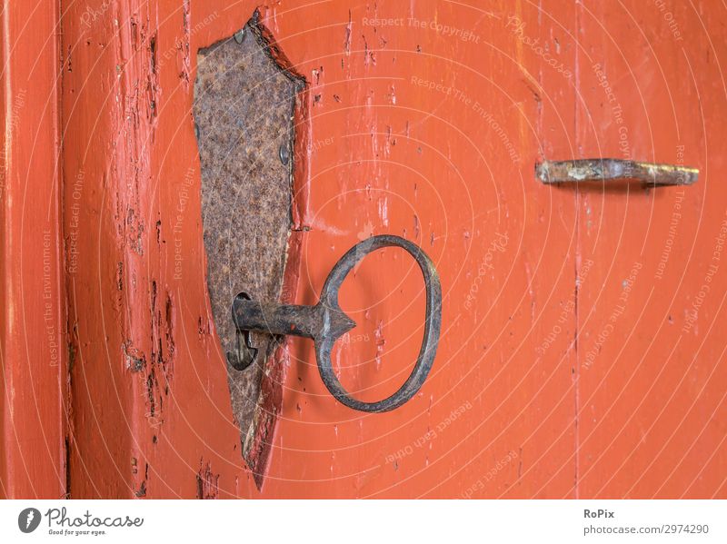 Wrought-iron castle in a historical door. Door lock ornaments Knocker door handle door fitting built House (Residential Structure) wood oak wood Iron Old