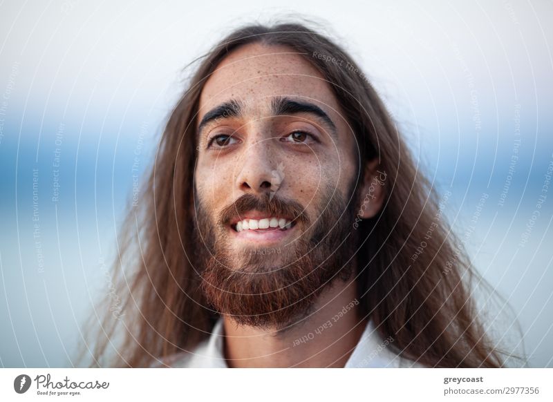 A portrait of a young man with long hair, a beard and a kind smile on his gace Human being Masculine Friendship Adults Face 1 Brunette Long-haired Beard Smiling