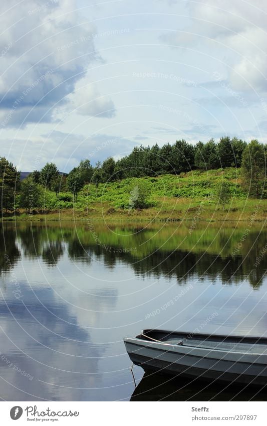 Peace and quiet by the lake in Scotland Lake boat Lakeside Scottish silent Nordic nature Nordic romanticism North Scottish nature Loneliness Picturesque
