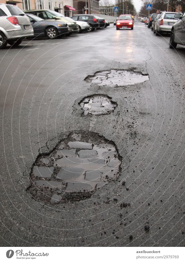 Potholes in asphalt / road damage Town Transport Means of transport Traffic infrastructure Road traffic Motoring Street Car Broken Wet Damage Asphalt Pavement