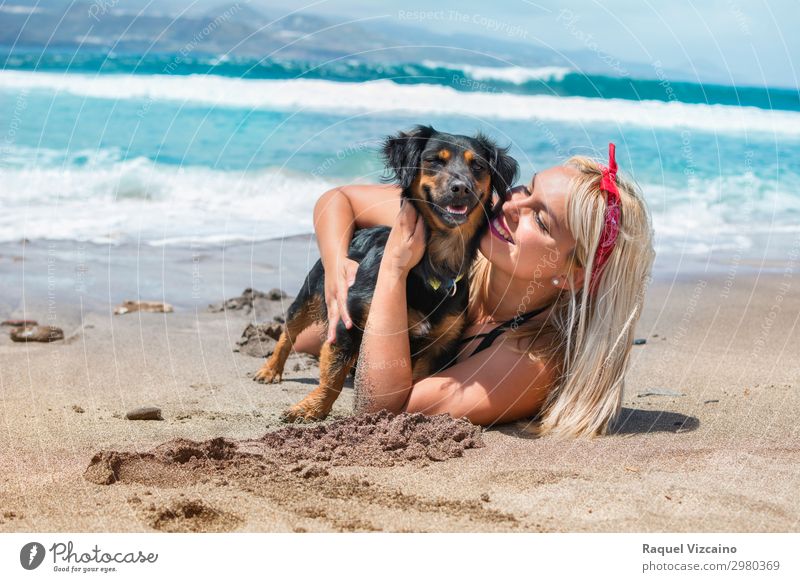 woman hugging her dog on the beach Lifestyle Well-being Vacation & Travel Tourism Summer Summer vacation Sunbathing Young woman Youth (Young adults) Head Face 1