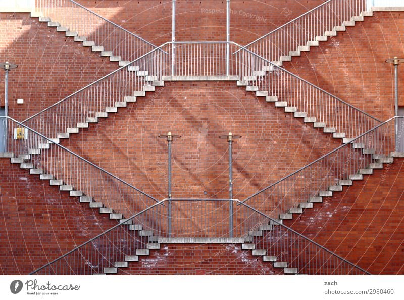Always on the wall. Ascension. Town Downtown Deserted Wall (barrier) Wall (building) Stairs Facade Brown Red Symmetry Steep Tall Go up Descent Colour photo