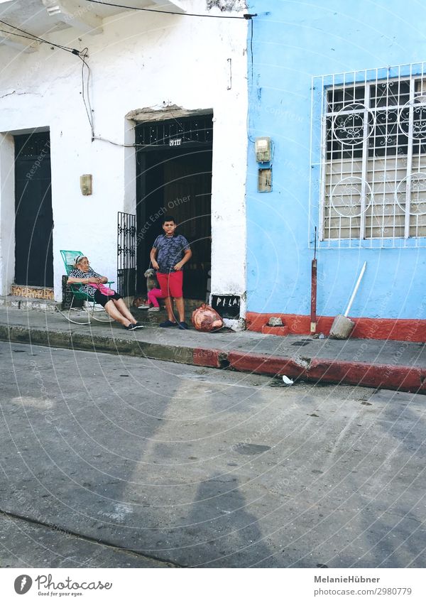 columbian street scene Human being Masculine Feminine Child Grandmother 2 Village To swing Stand Blue Colombia Street life Travel photography South America