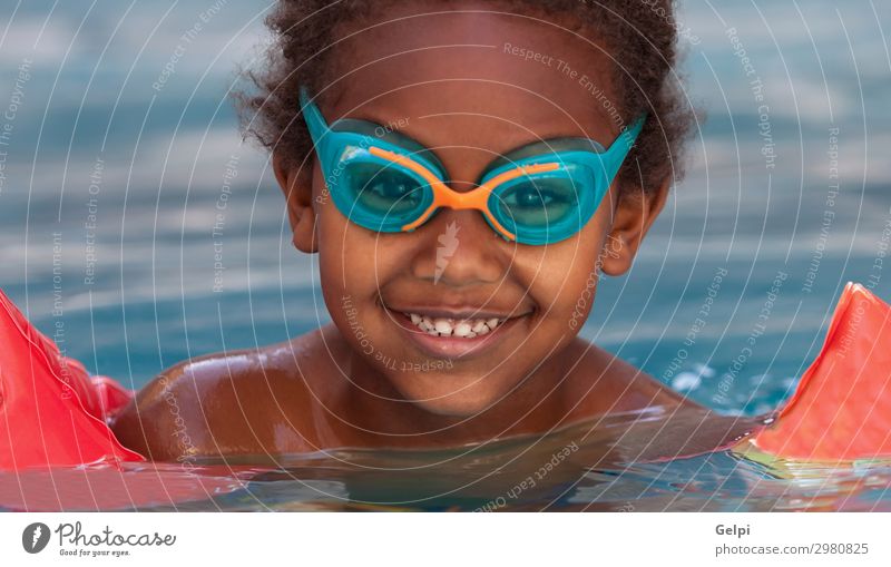 Little african child in the pool Lifestyle Joy Happy Beautiful Relaxation Swimming pool Leisure and hobbies Playing Vacation & Travel Summer Child School