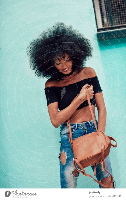 Young mixed woman with afro hair standing on the street Lifestyle Style Happy Beautiful Hair and hairstyles Face Human being Feminine Young woman
