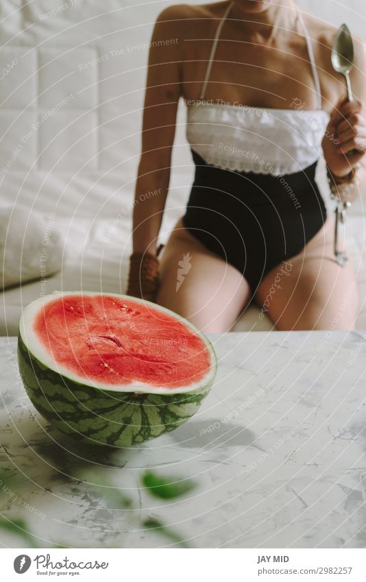 beautiful woman eating watermelon indoor Food Fruit Nutrition Eating Spoon Lifestyle Happy Beautiful Summer Human being Feminine Woman Adults Hand Legs