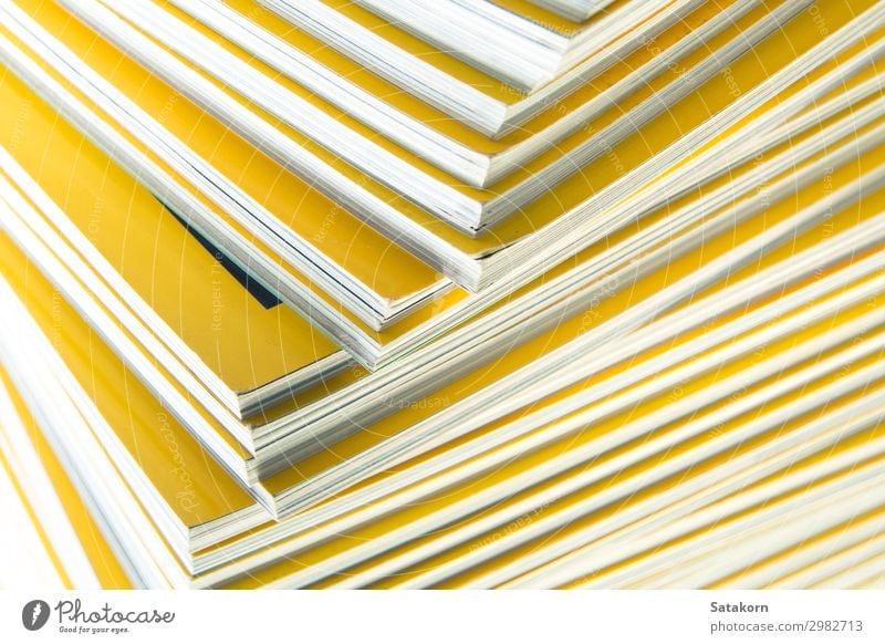 Stack of yellow monthly magazine Reading Book Library Paper Collection Yellow White Colour Accumulation background education Press issue Journalism printing