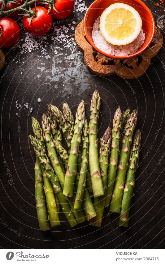 Green asparagus on a dark rustic kitchen table Food Vegetable Nutrition Organic produce Vegetarian diet Diet Design Healthy Eating Asparagus cooking preparation