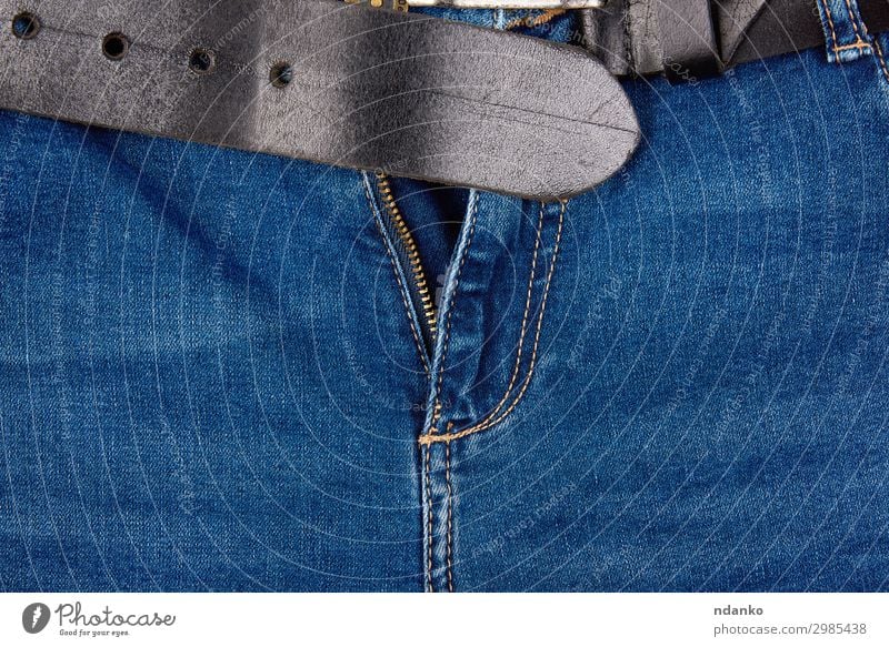 open fly in blue jeans and a black leather belt Style Design Fashion Clothing Pants Jeans Metal Modern Blue Zipper unzipped background Open Consistency textile