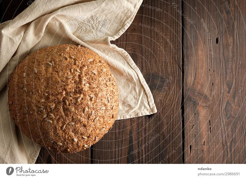 baked round rye bread with sunflower seeds Bread Roll Nutrition Eating Breakfast Diet Table Wood Dark Fresh Delicious Natural Above Brown Tradition crusty