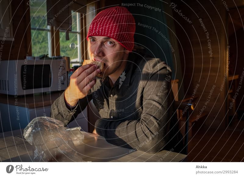 sandwich for the break Bread Nutrition Eating Slow food Finger food Flat (apartment) Young man Youth (Young adults) Sunlight Hut Shirt Cap Natural Break