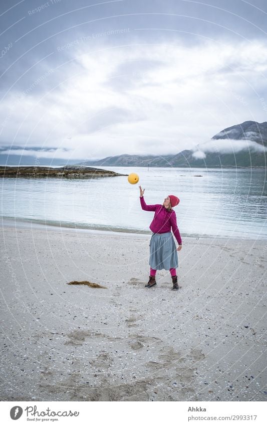 Lightness. Young woman juggles on the beach Beach Youth (Young adults) Clouds Ocean Arctic Ocean Norway Throw Curiosity Happy Happiness Joie de vivre (Vitality)