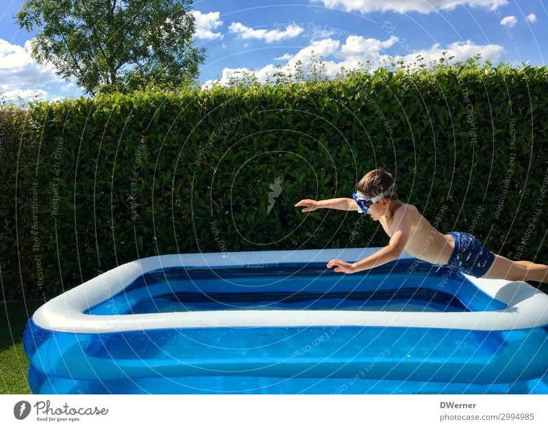 Superman Leisure and hobbies Summer Summer vacation Sunbathing Swimming pool Boy (child) Sunlight Beautiful weather Garden Swimming trunks Water Jump Romp