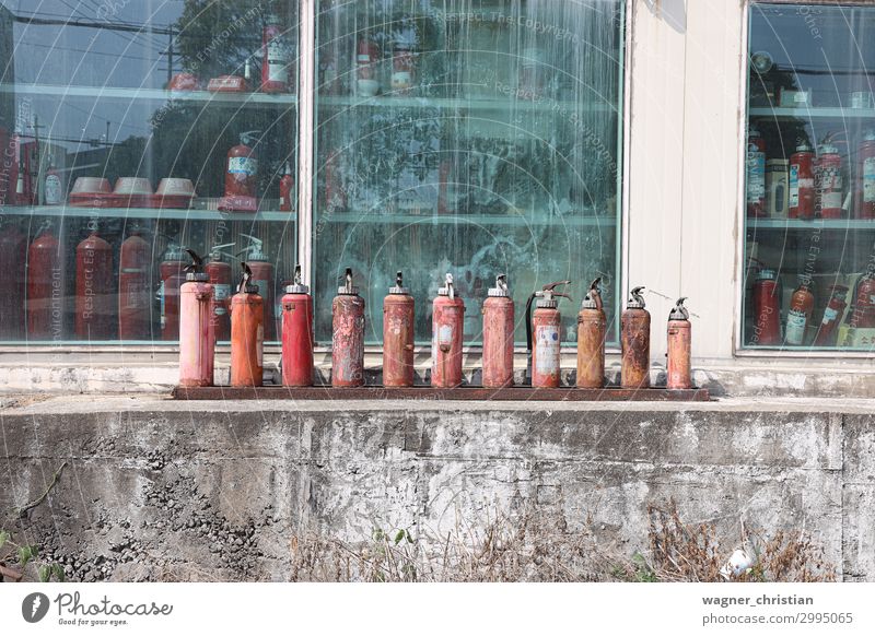 Old fire extinguishers Metal Steel Poverty Authentic Exceptional Hideous Kitsch Retro Trashy Red Safety Protection Disaster Shopping Sadness Transience