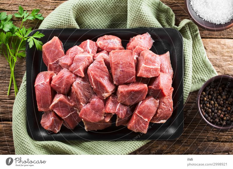 Fresh Raw Diced Beef Meat Red food Ingredients cooking Cut piece strips preparing lean diced cube Goulash iron Cast iron overhead Top Horizontal ingredient
