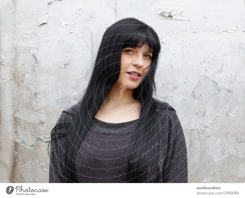 young woman with long black hair Lifestyle Human being Feminine Young woman Youth (Young adults) Woman Adults 1 18 - 30 years Wall (barrier) Wall (building)