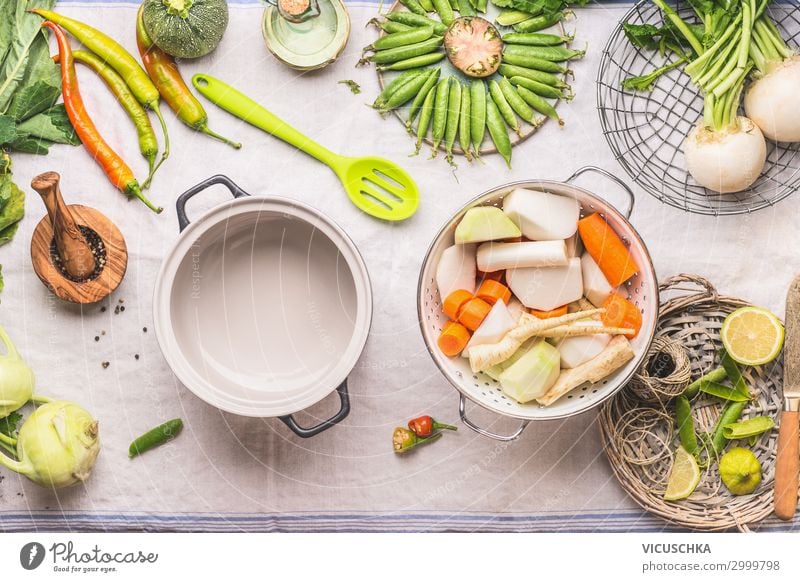 Selection of seasonal vegetables on the kitchen table Food Vegetable Soup Stew Herbs and spices Nutrition Organic produce Vegetarian diet Diet Crockery Pot