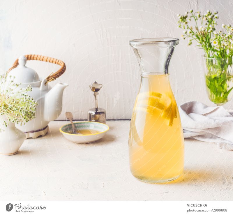Carafe with white tea lemon lemonade Beverage Cold drink Drinking water Lemonade Juice Style Healthy Eating Summer Living or residing Cool (slang) Yellow Design