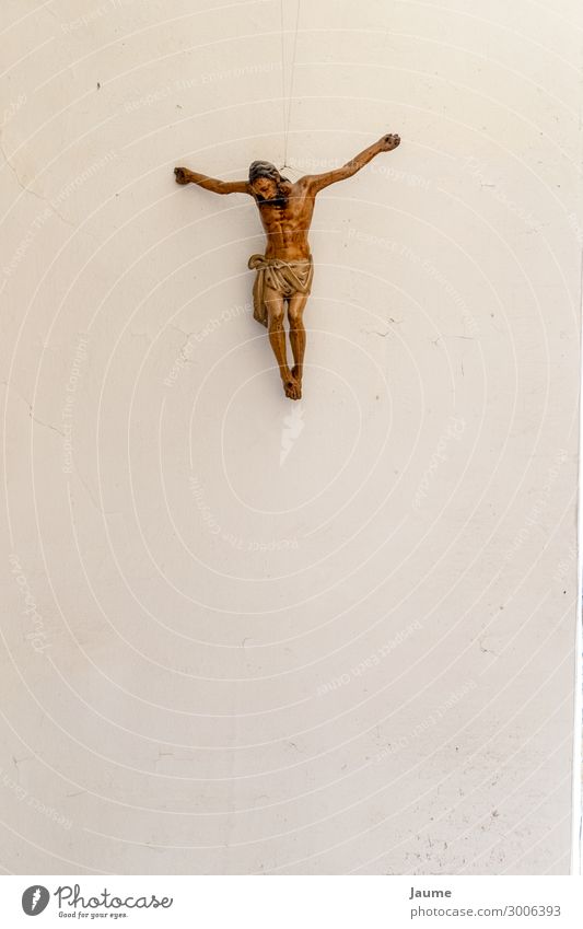 Christ on a white wall Human being Masculine Man Adults Male senior 1 Art Crucifix Religion and faith Colour photo Interior shot Day