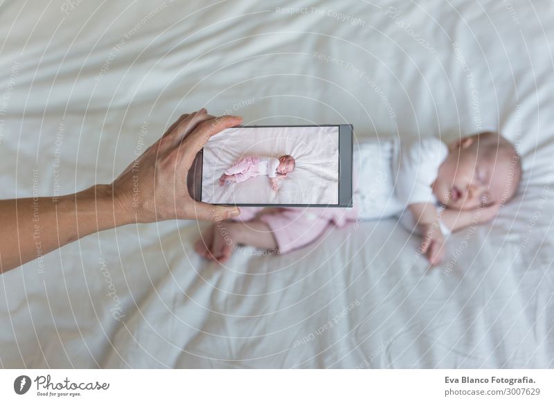 mother taking a picture of her baby girl sleeping on bed Beautiful Skin Face Relaxation Child Telephone Technology Internet Baby Hand Sleep Dream Small New Cute