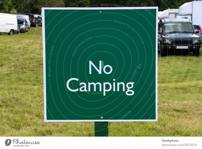 No Camping Sign at a Country Fair Vacation & Travel Landscape Tree Grass Leaf Field Vehicle Car Wood Signage Warning sign Green White Placard board warning
