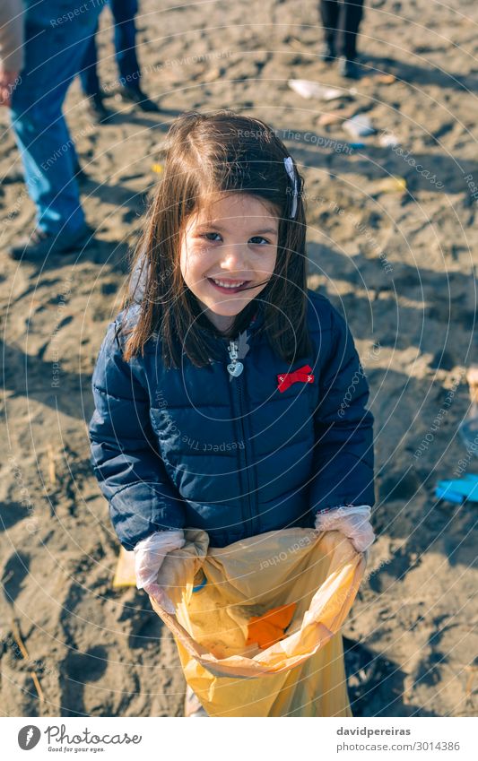 Girl showing garbage collected from the beach Happy Beach Child Work and employment Human being Woman Adults Hand Group Environment Sand Plastic Smiling Dirty