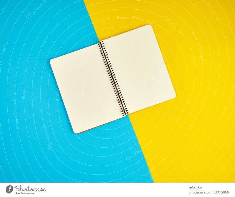 open spiral notebook with blank white pages School Office Business Book Paper Write Above Clean Blue Yellow White Idea flat Conceptual design List background
