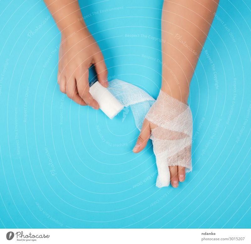 arm wrapped in a white sterile bandage Body Health care Medical treatment Illness Medication Human being Woman Adults Arm Hand Fingers To hold on Clean Blue
