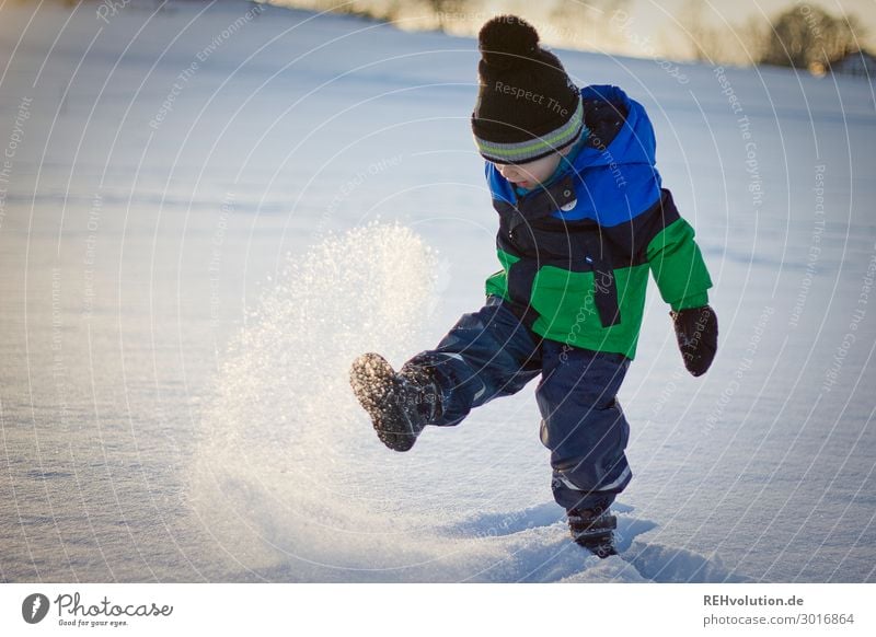 Child plays in the snow Leisure and hobbies Playing Human being Boy (child) Infancy 1 3 - 8 years Environment Nature Winter Weather Beautiful weather Ice Frost