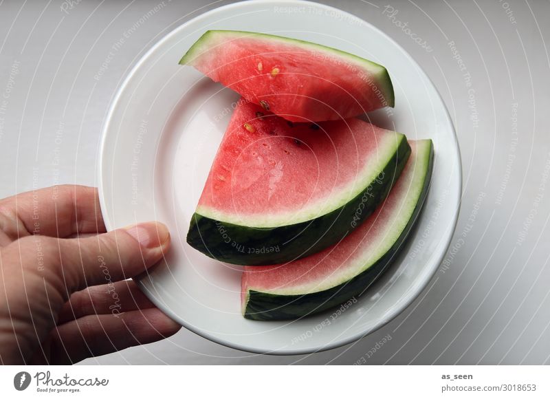 Summer refreshment Fruit Water melon Eating Buffet Brunch Banquet Vegetarian diet Diet Plate Hand To hold on Fresh Healthy Hip & trendy Round Juicy Green Red
