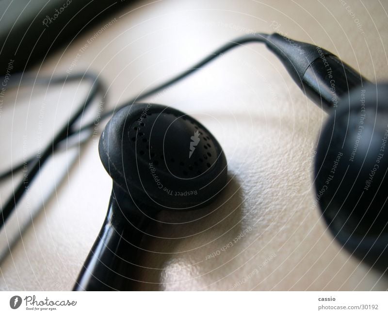 Earplugs. Headphones Headset Black Table Loudspeaker Listening Entertainment Music Cable