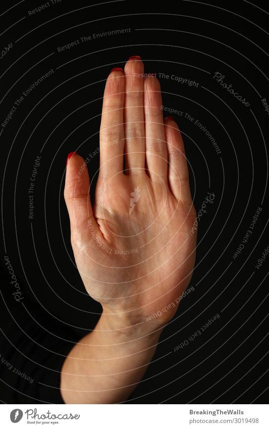 Woman hand palm showing stop gesture over black Human being Feminine Young woman Youth (Young adults) Adults Hand 1 Red Black White Self-confident Power Brave
