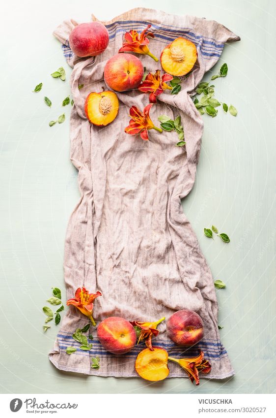 Whole and half peaches on kitchen towel with leaves Food Fruit Nutrition Organic produce Vegetarian diet Diet Style Design Healthy Eating Table Yellow