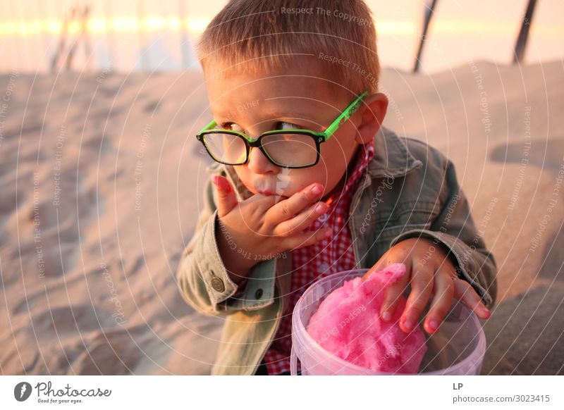 Child eating candy floss and licking his fingers Food Dessert Nutrition Eating Diet Fasting Fast food Parenting Education Emotions Moody Appetite Remorse Fear
