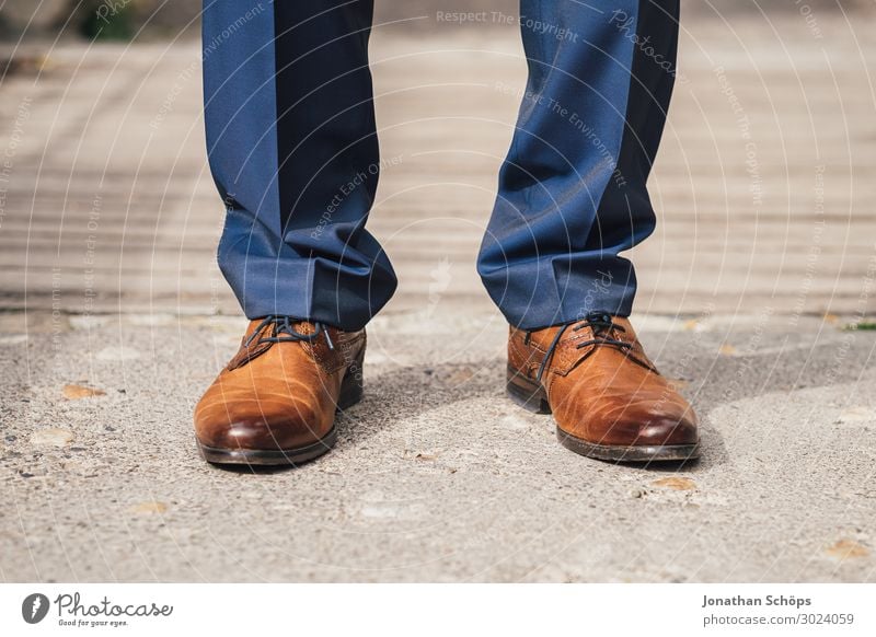 brown leather shoes for men with suit trousers - a Royalty Free Stock Photo  from Photocase