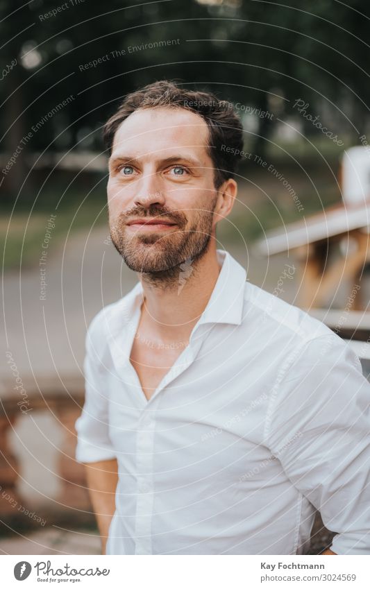 handsome man in white shirt looking up attractive beard bearded caucasian cheerful confident friendly guy happiness happy lifestyle male masculine outdoor