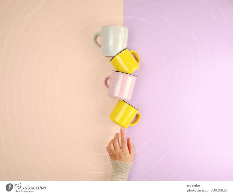 stack ceramic cups Breakfast Beverage Coffee Tea Cup Mug Kitchen Woman Adults Arm Hand Fingers Select Hot Bright Clean Yellow Pink Moody Colour Idea Caucasian