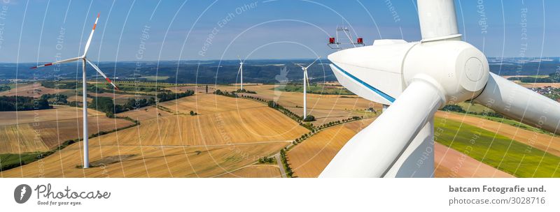 Panorama of a wind farm and close-up view Technology Energy industry Renewable energy Wind energy plant Environment Landscape Sky Summer Autumn
