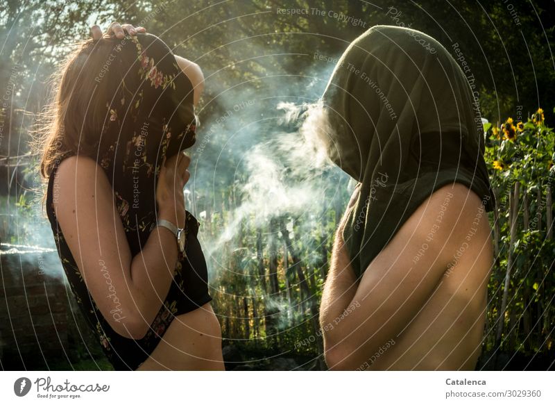 Making nonsense while smoking, two people cover their faces while smoking Smoking Summer Masculine Feminine 2 Human being Nature Plant Beautiful weather Tree