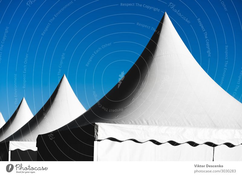 Pointed tents against the blue sky Beautiful Summer Decoration Entertainment Environment Nature Landscape Sky Building Architecture Bright Tall Modern Blue
