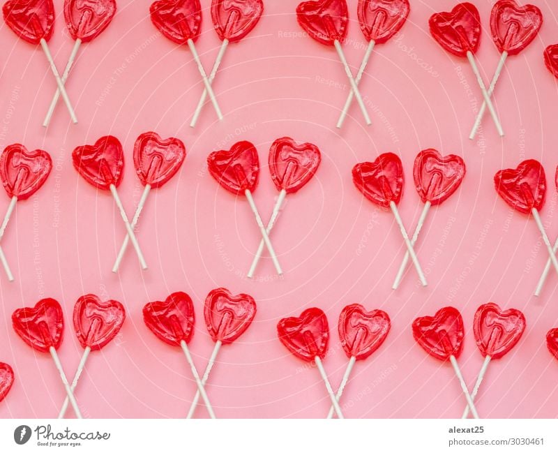 Two red heart lollipop pattern on pink background Dessert Joy Valentine's Day Art Heart Love Bright Delicious Red White Romance Colour candy colorful