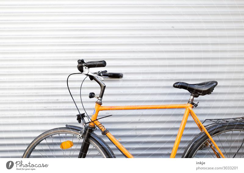 men's bicycle Deserted Disk Garage door Cycling Bicycle Metal Line Stripe Simple Yellow Black White Ajar Poised to act Parking Parking area Colour photo