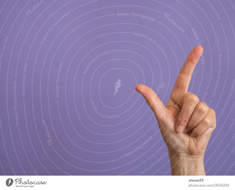 Hand with two fingers raised on purple background and copy space Human being Woman Adults Arm Fingers Idea Conceptual design Copy Space Numbers Doppelganger