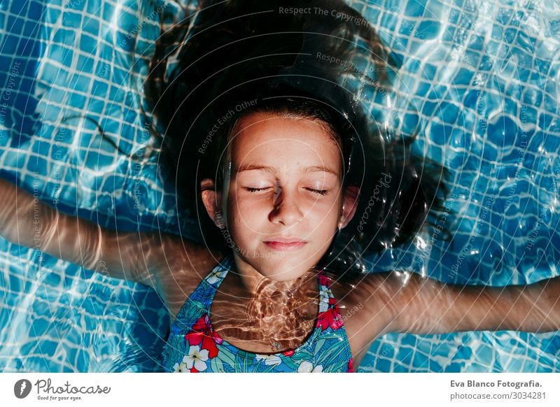beautiful teenager girl floating in a pool. summer lifestyle Lifestyle Joy Happy Beautiful Relaxation Swimming pool Leisure and hobbies Vacation & Travel Summer