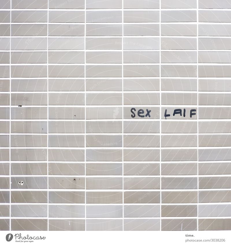 Laif is Laif Wall (barrier) Wall (building) Facade Tile Sign Characters Signs and labeling Graffiti Line Stripe Sharp-edged Funny Trashy Gloomy Gray Passion