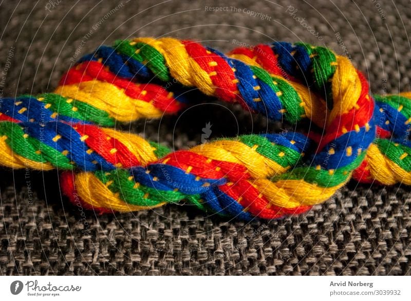 A rainbow colored knot Joy Beautiful Handicraft Handcrafts Decoration Rope Braids Stripe Knot Rotate Esthetic Simple Happiness Together Blue Multicoloured