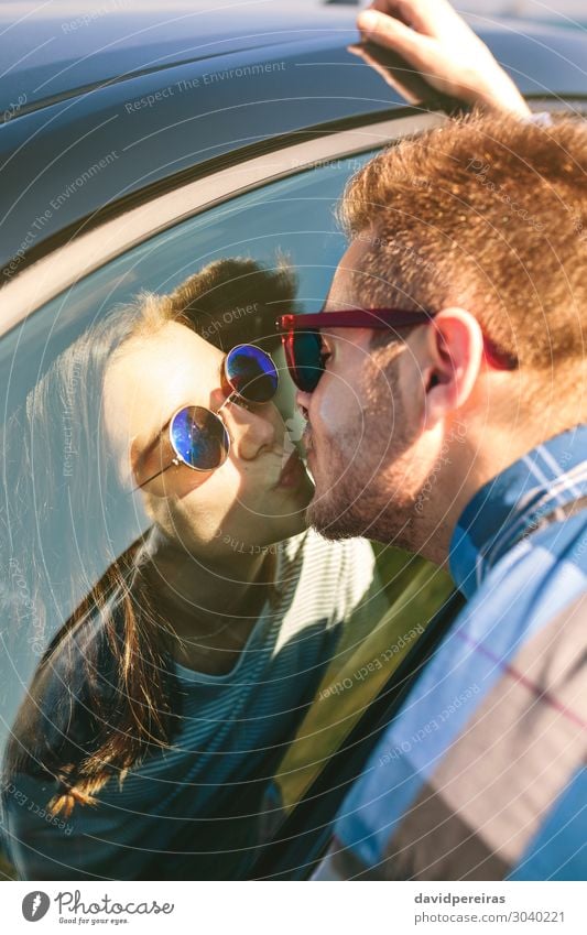 Young couple kissing through the glass Lifestyle Vacation & Travel Adventure Far-off places Ocean Human being Woman Adults Man Couple Grass Meadow Coast Vehicle
