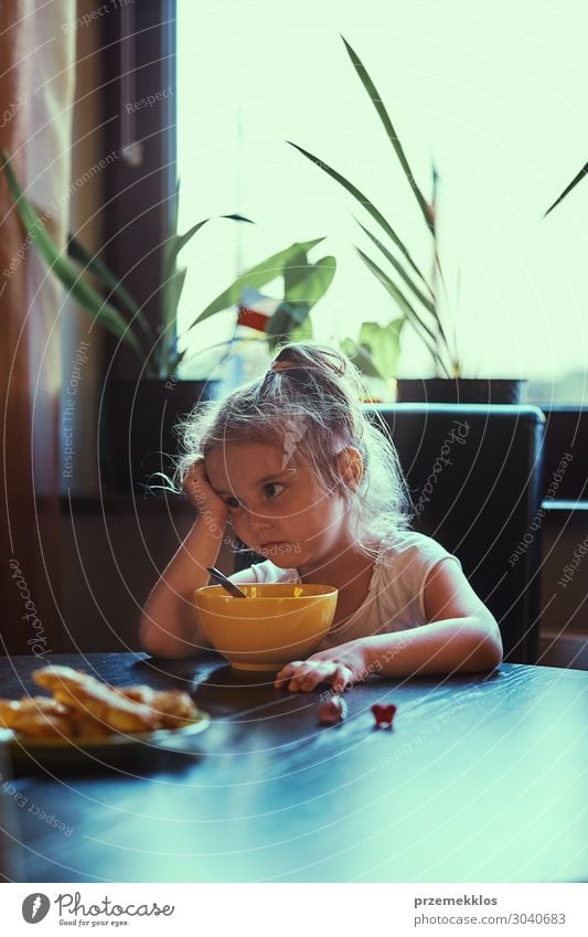 Little girl eating a breakfast Eating Breakfast Lifestyle Table Child Human being Girl Family & Relations 1 3 - 8 years Infancy Think Sit Authentic Small